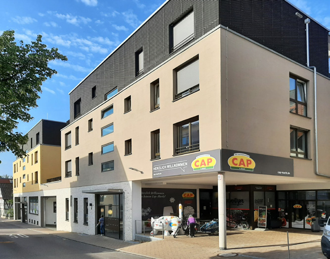 Mehrfamilienhäuser mit integriertem CAP-Lebensmittelmarkt